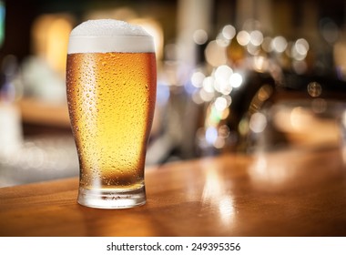 Beer glass on the bar counter. - Shutterstock ID 249395356
