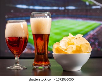 Beer Glasses And Chips In Front Of Tv, Football At Home, Soccer Supporters