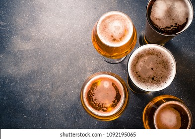 Beer Glasses On Dark Table. Top View