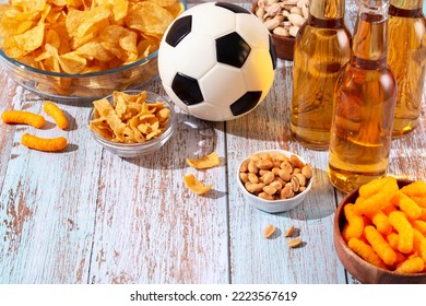 Beer In Glasses And Snack On Wooden Table With Football Ball, Football Game Night Food