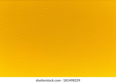 Beer With Golden Drops Of Condensation