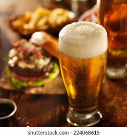 beer with hamburgers on restaurant table - Shutterstock ID 224068615