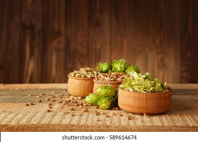 Beer Ingredients On Wooden Background