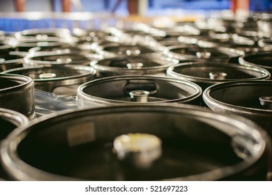 Beer Kegs. Many Metal Beer Keg Stand In Rows In A Warehouse