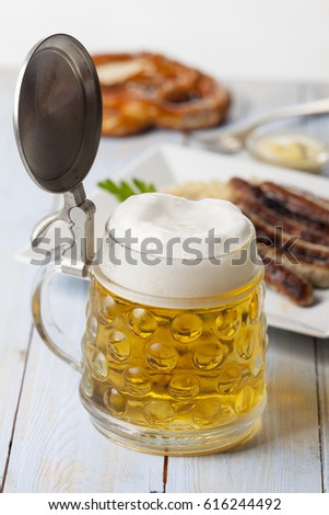 beer in a mug and nuremberg bratwurst 
