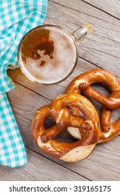 Beer Mug And Pretzel On Wooden Table. Top View