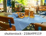Beer mugs with fresh pretzels or brezen at Oktoberfest, Munich, Germany