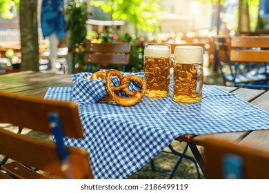Beer mugs with fresh pretzels or brezen at Oktoberfest, Munich, Germany