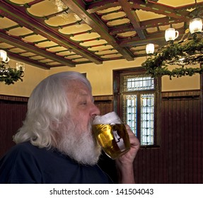 Beer - Older Bearded Man Drinking A Beer In The Pub