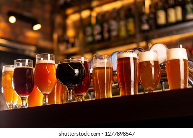 a lot of beer on bar table