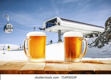 beer on desk and winter landscape of snow 