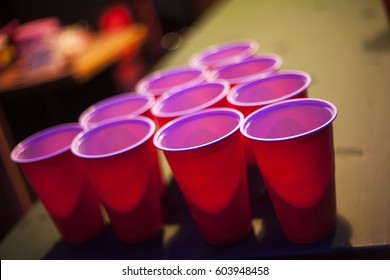 Beer Pong Playing At A Party, American Red Cups In Night Club 