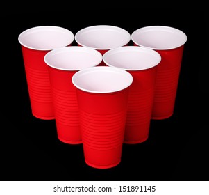 Beer Pong. Red Plastic Cups Over Black Background