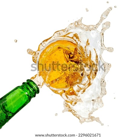 Beer pour from a green bottle and splash, top view on white background