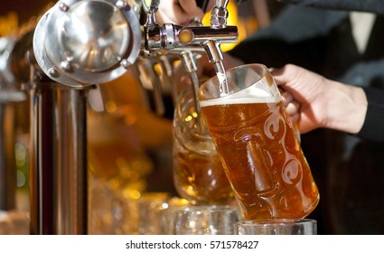 Beer Is Poured Into A Glass