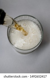 Beer Pouring From The Bottle Into Glass Close Up View From Above