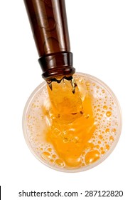 Beer Pouring From A Brown Bottle, Top View