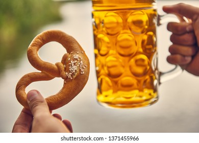 Beer And Pretzel In Hand, Holding Pretzel And Beer