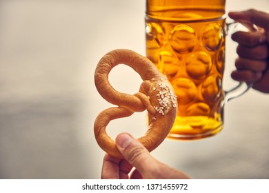 Beer And Pretzel In Hand, Holding Pretzel And Beer