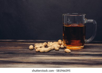 beer with roasted peanuts in shells.