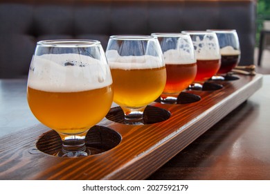 Beer Set, Set Of Glasses Of Light And Dark Beer On A Pub Background. Craft Beer Sample Tray