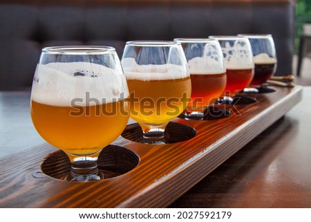 beer set, Set of glasses of light and dark beer on a pub background. Craft beer sample tray