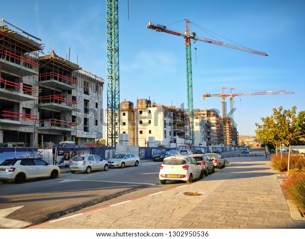 Beer Sheva, Israel-August 21, 2018:\
Eight multi stories living towers are in construction in a new\
development project Open Valley in Ramot\
neighborhood