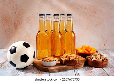 Beer And Snack On Wooden Table With Football Ball, Football Game Night Food