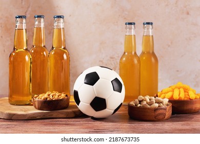 Beer And Snack On Wooden Table With Football Ball, Football Game Night Food