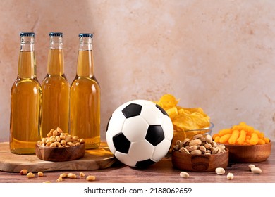 Beer And Snack On Wooden Table With Football Ball, Football Game Night Food