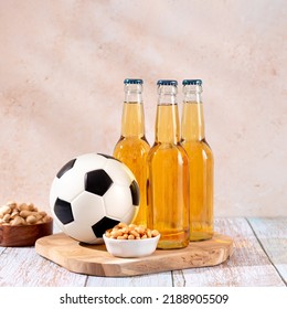 Beer And Snack On Wooden Table With Football Ball, Football Game Night Food