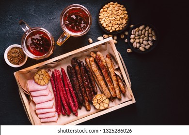 Beer And Snacks. Bar Menu. Restaurant, Pub, Food Concept. Craft Lager Drink, Nuts And Meat Appetizers Set- Ham, Grilled Sausages And Salami. Friday Party Atmosphere, Craft Brewery Background