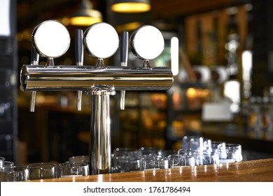 Beer tap in bar, mock up with selective focus.