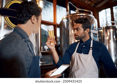 Beer, taste and test with men in brewery together for quality control of beverage, drink or manufacturing process. Alcohol, industry and tablet with partner people in small business for production - Powered by Shutterstock