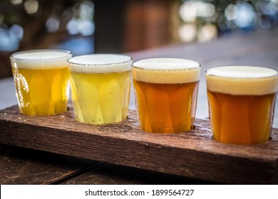 Beer Tasting Paddle With Peanuts On A Wooden Table