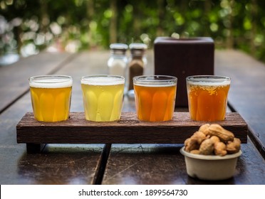 Beer Tasting Paddle With Peanuts On A Wooden Table