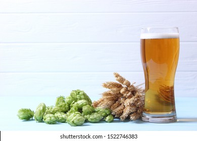 Beer, Wheat And Hops On The Table.
