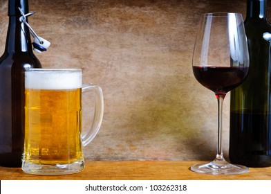Beer and wine with text copy space on a wooden background
