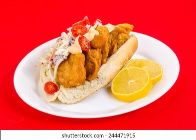 Beer-battered shrimp deep fried on bun with coleslaw and spicy mayonnaise spread with tomato and other Cajun Seasoning.