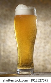 Beer.Pint Of Beer Close Up Isolated On Abstract Background. Cold Craft Light Beer In A Glass