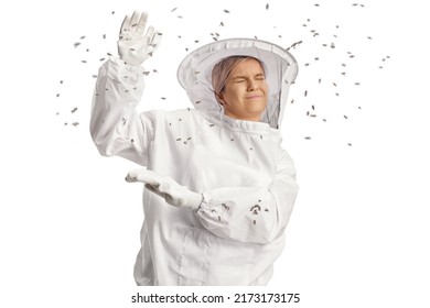 Bees attacking a young female bee keeper in a uniform isolated on white background
