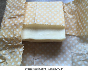 A Beeswax Food Wrap Covering Cheddar Cheese