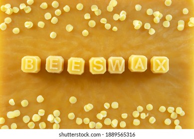 Beeswax Letters Made From Yellow Natural Beeswax On  Beeswax Texture Background.