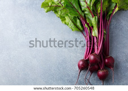 Beet, beetroot bunch on grey stone background. Copy space. Top view.