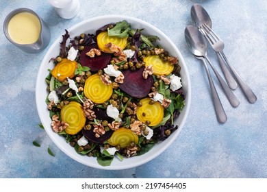 Beet And Goat Cheese Salad With Orange Dressing And Yellow And Red Beets