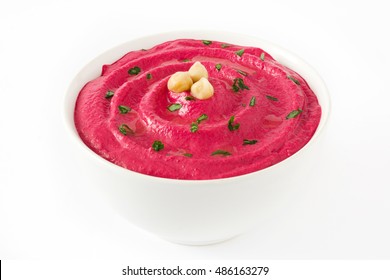 Beet hummus in a bowl isolated on white background

