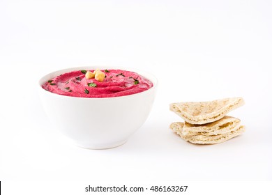 Beet hummus in a bowl with pita bread isolated on white background

