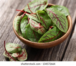 Beet Leaves In A Wooden Plate