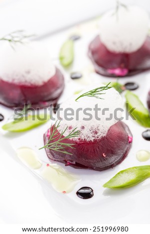 Beet root salad with asparagus on white plate