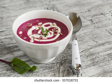 Beet Soup In A White Bowl On Bright Wooden Surface - Healthy Food